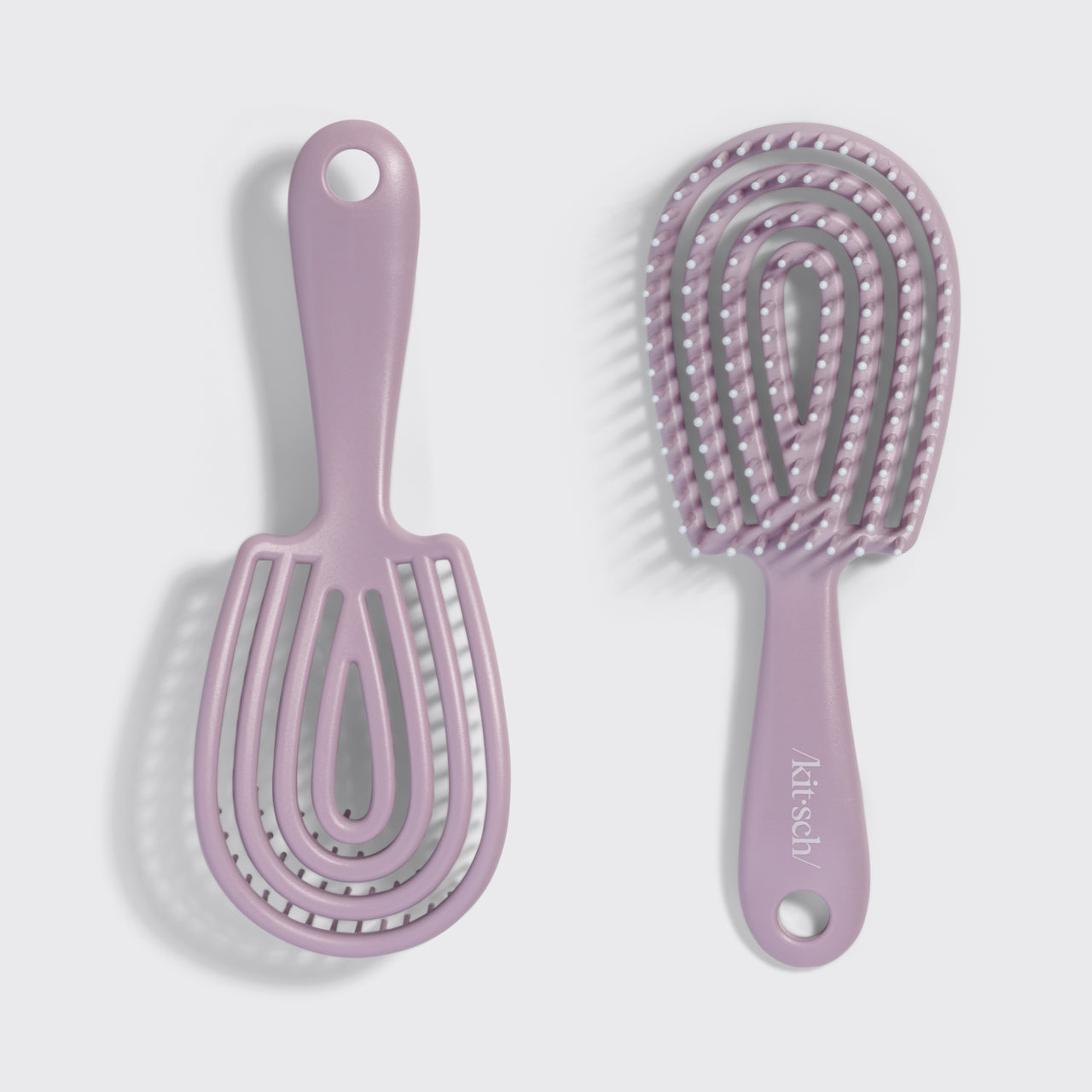 KITSCH Soft Violet Detangling Flexi Brush - Mini — model using the brush on hair — Bendable Bristles: adapts to the shape of your head for a comfortable and effortless detangling experience — gliding smoothly through tangles