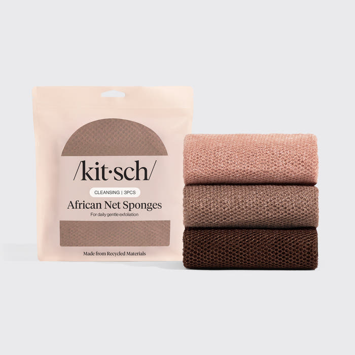 Kitsch Rosewood African Net Sponge stretched open showing mesh texture on pink background