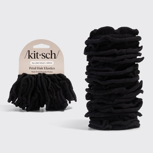 Black petal hair elastics with 'Kitsch' packaging on a light gray background
