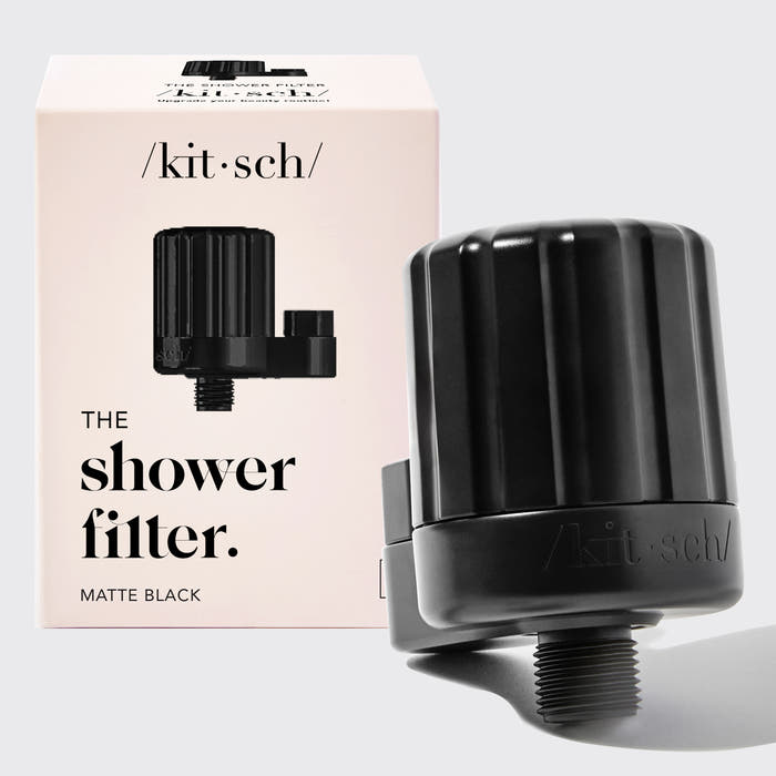 Kitsch Black Shower Filter with packaging on a light gray background