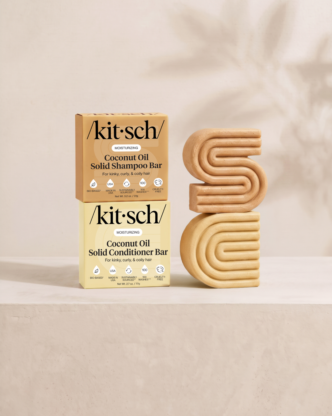 Kitsch Moisturizing Coconut Oil Solid Shampoo and Conditioner Bars shown side by side with retail packaging – deeply hydrates and adds shine for dry, damaged and frizzy hair