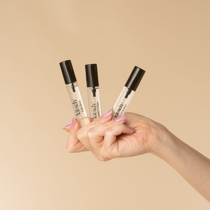 Kitsch Coastal Hair Perfume Trio Set - lifestyle model shot, all 3 bottles in hand